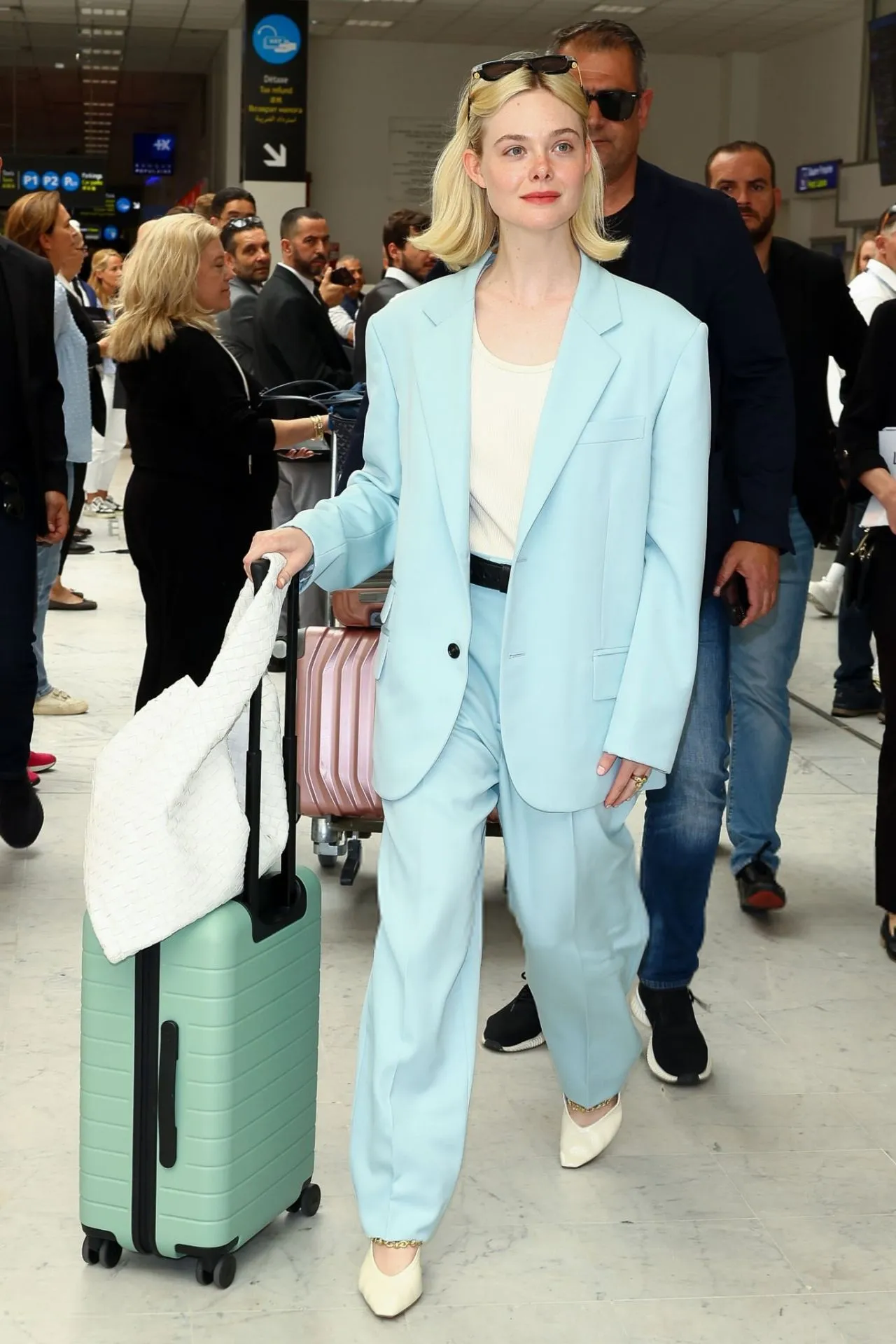 ELLE FANNING REDEFINES JET-SET STYLE IN BOTTEGA VENETA